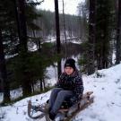 Яна Богданова на саночках прадедушки С.П. Артемьева на берегу реки Кумса.